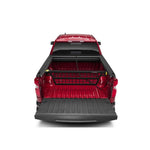 Roll-N-Lock Cargo Manager movable bed divider with driver-side control levers and lateral tie-offs.