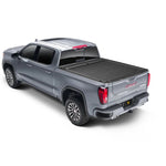 Roll-N-Lock M-Series retractable tonneau cover with vinyl-over-aluminum construction for Chevy Silverado and GMC Sierra HD.