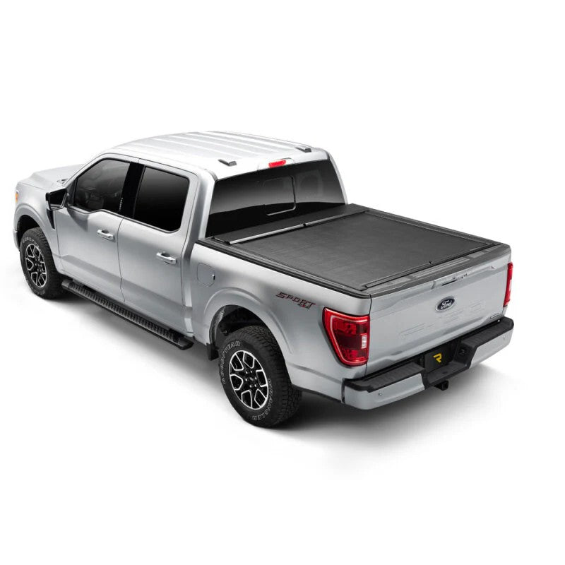 Roll-N-Lock M-Series retractable tonneau cover with vinyl-over-aluminum slats on a Ford F-150 truck bed.