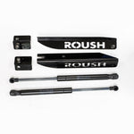 Roush gas-charged hood struts with black e-coated stainless steel laser-cut brackets installed on a Ford Mustang.