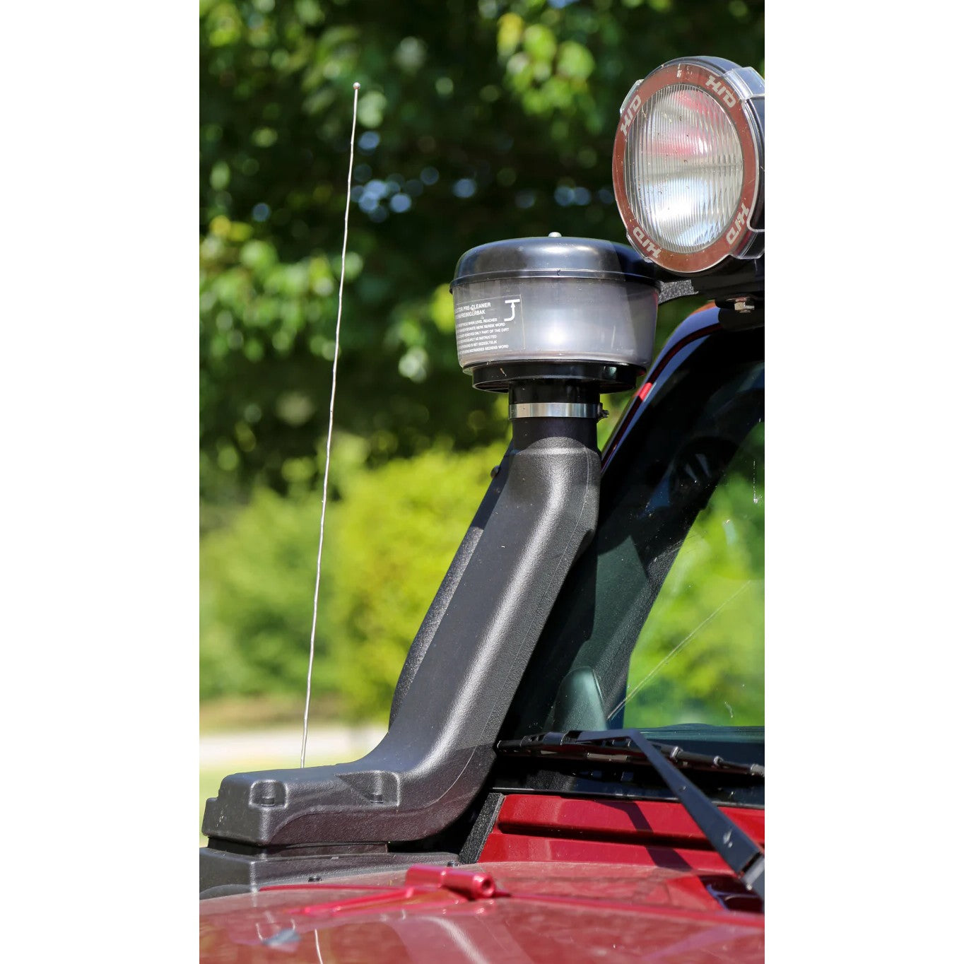 Rugged Ridge XHD modular snorkel system with low mount pre-filter installed on a Jeep Wrangler JK fender