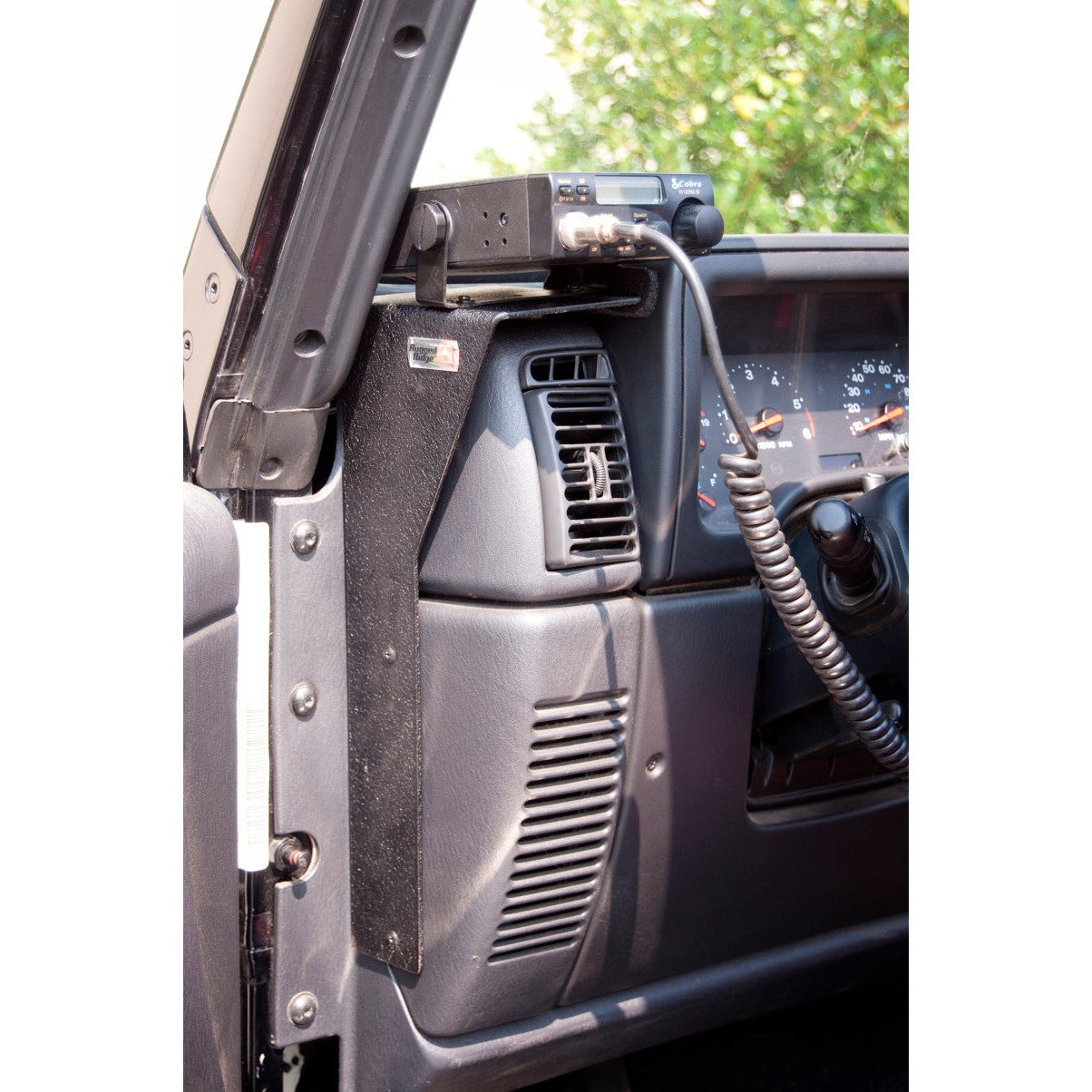 Black Rugged Ridge CB radio dash mounting bracket with included hardware for 1997-2006 Jeep Wrangler TJ