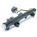 Skunk2 black composite high volume fuel rail featuring carbon-impregnated polymer construction for K-Series engines.