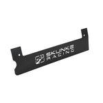 Black powder coated Skunk2 K-series spark plug cover with laser-cut logo and aluminum contrast plate for Honda engines.