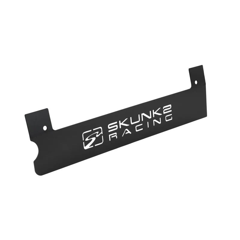 Black powder coated Skunk2 K-series spark plug cover with laser-cut logo and aluminum contrast plate for Honda engines.