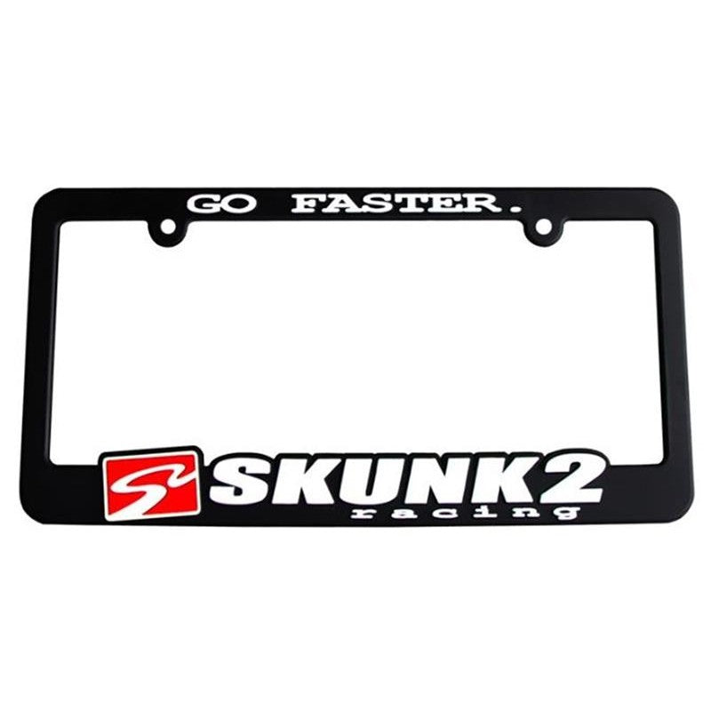 Black Skunk2 Go Faster license plate frame with red and white logo and tagline