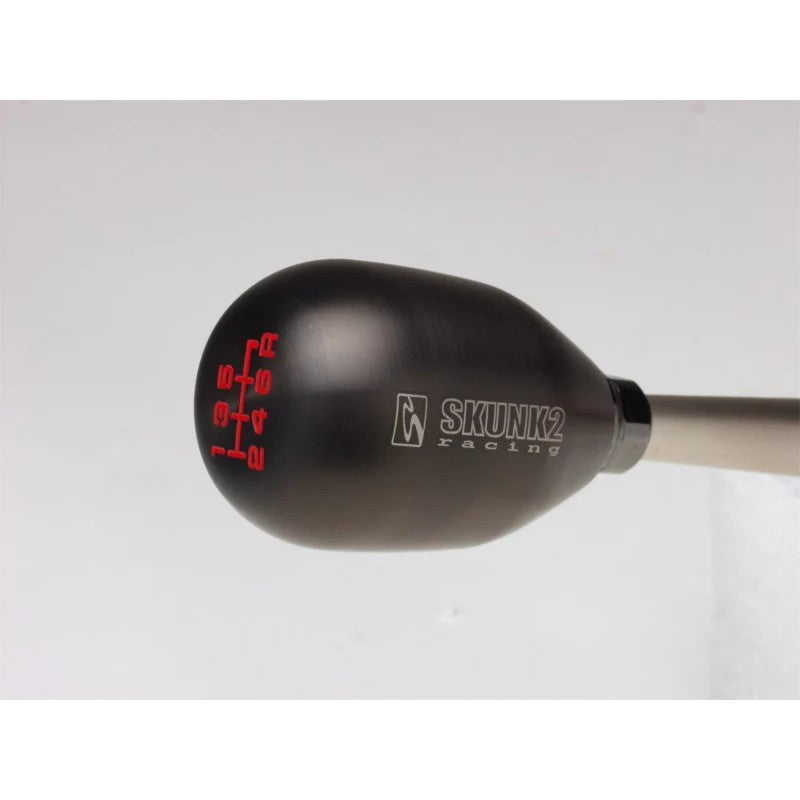 Skunk2 440 gram billet stainless steel 6-speed shift knob with PVD titanium finish and 10mm x 1.5mm threads.