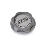 Gun metal hard anodized Skunk2 billet oil cap with acid-etched logo and M33 x 2.8 thread pitch.