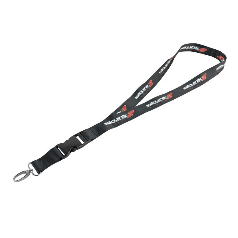 Black woven Skunk2 lanyard with white and red classic logo lettering