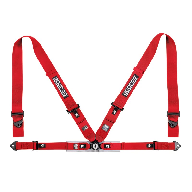 Red Sparco 4-point competition racing harness with 3-inch shoulder straps, 2-inch lap belts, and central rotary buckle.