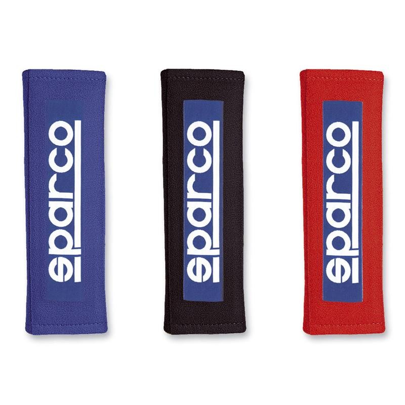 Red Sparco 3-inch racing seat belt shoulder pads with white embroidered Sparco logo and hook-and-loop closure.