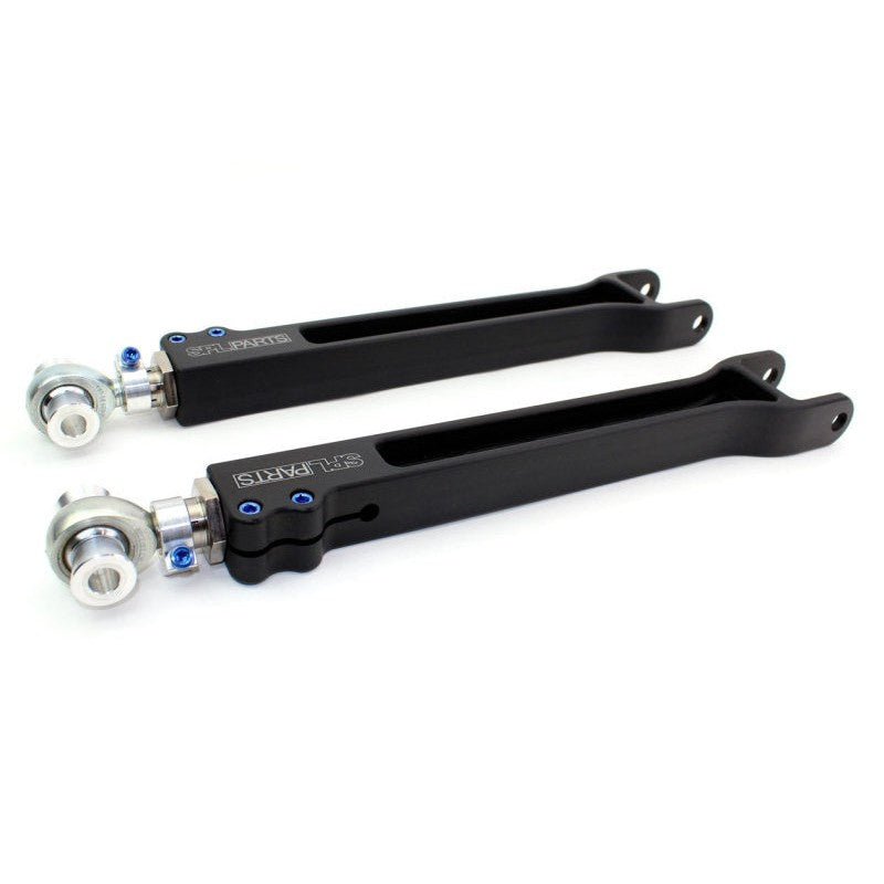 Pair of SPL Parts 6061-T6 billet aluminum rear toe arms with blue titanium hardware and FK spherical rod ends.
