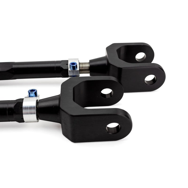SPL Parts rear traction links featuring gun-drilled 2024 aluminum and blue titanium hardware for BMW F3X chassis.