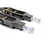Black anodized 6061-T6 aluminum rear lower camber arms with blue titanium hardware and chromoly adjusters.
