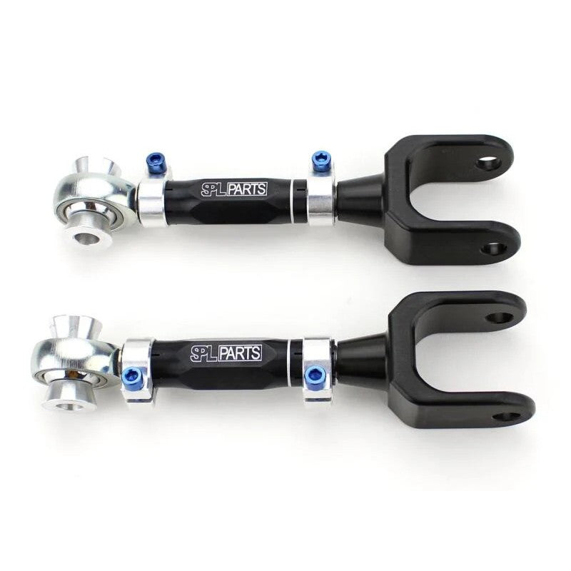 Pair of SPL Parts CNC billet aluminum rear traction arms with blue titanium hardware and FK spherical rod ends.