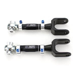 Pair of SPL Parts CNC billet aluminum rear traction arms with blue titanium hardware and FK spherical rod ends.