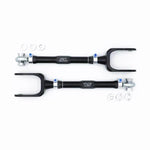 SPL Parts adjustable front trailing arms with gun-drilled aluminum rods and blue titanium hardware for Porsche.