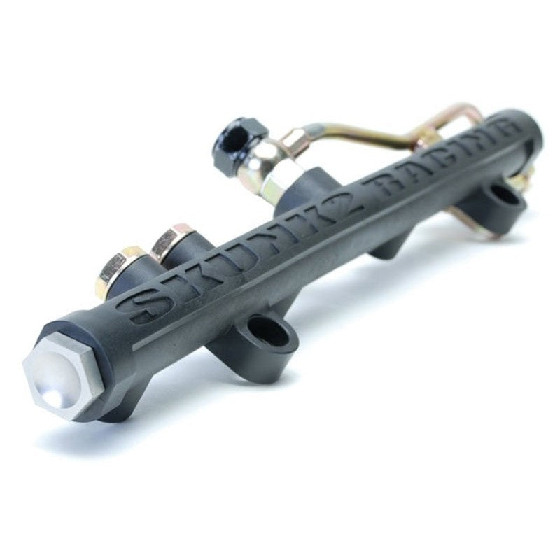 Skunk2 carbon-composite high volume fuel rail with -8 AN ports for 2006-2011 Honda Civic Si.