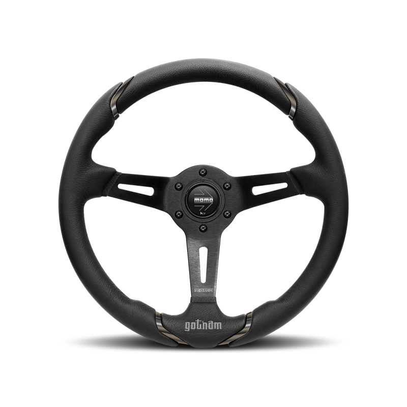 Momo Gotham 350mm steering wheel featuring black leather wrap and three black spokes with central horn button.