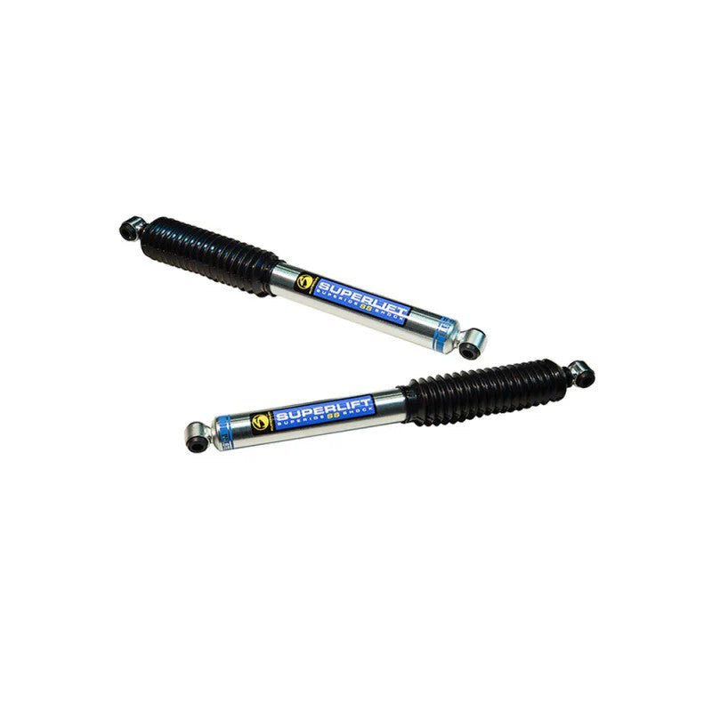 Superlift 95030 dual steering stabilizer kit featuring two Bilstein 5100 cylinders with black boots and bushings.