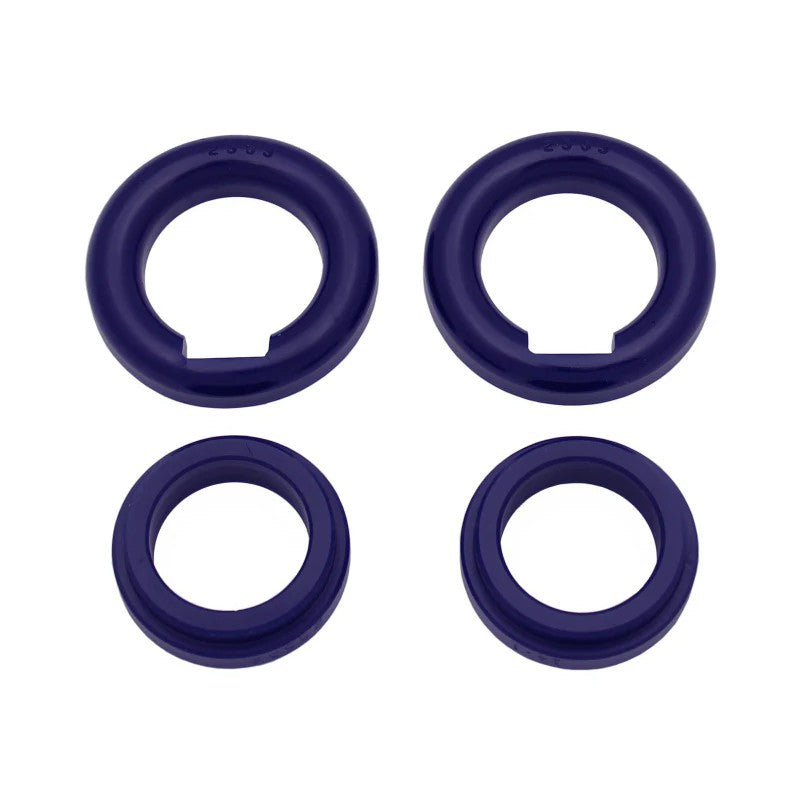 Blue SuperPro polyurethane rear forward subframe insert bushings with metal sleeves for Toyota Supra and Lexus SC models.