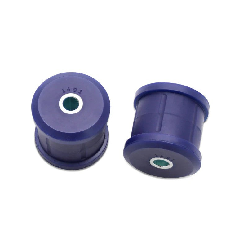 Blue SuperPro polyurethane bushings and metal crush tubes for rear trailing arm lower forward mounting.