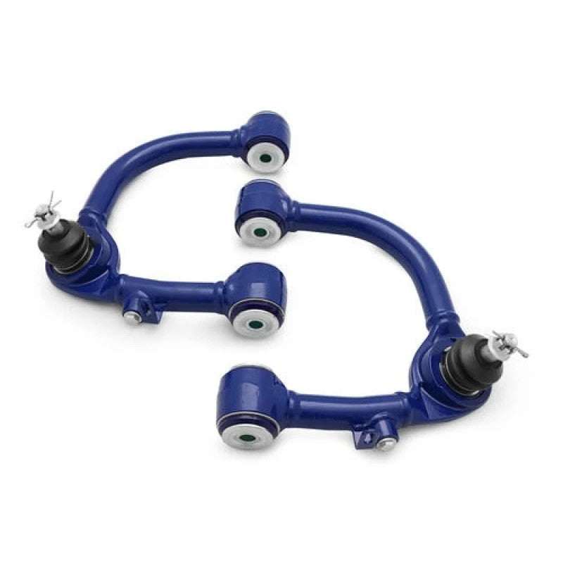 Pair of black powder-coated SuperPro fixed offset upper control arms with pre-installed ball joints and bushings.