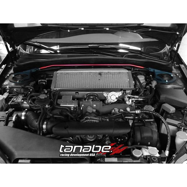 Tanabe Sustec front strut tower bar with silver aluminum crossbar and red steel mounting brackets.