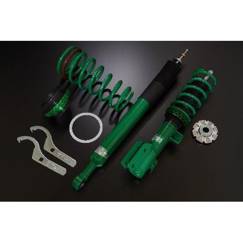Tein Street Basis Z height-adjustable coilover dampers with signature green finish and black springs for Acura Integra.