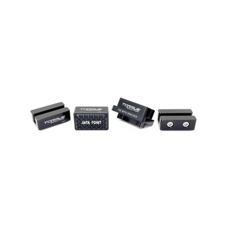 Black Torque Solution pinch weld saver jack pad featuring a precision-cut slot for vehicle lift point protection.