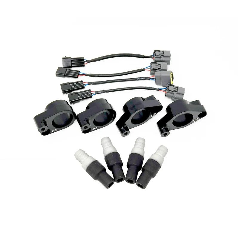 Torque Solution R35 GTR coil-on-plug adapter plates and mounting hardware for Subaru EJ20 and EJ25 engines.