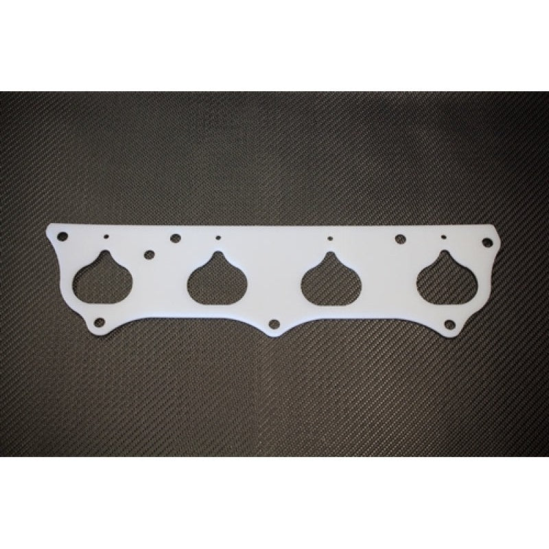 High-temperature polymer thermal intake manifold gasket for 2002-2005 Acura RSX K20 engines.