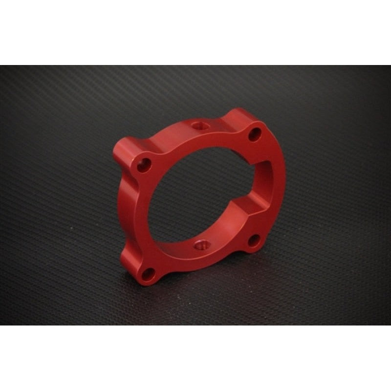 Red anodized Torque Solution throttle body spacer for 2010-2014 Hyundai Genesis Coupe 2.0T.