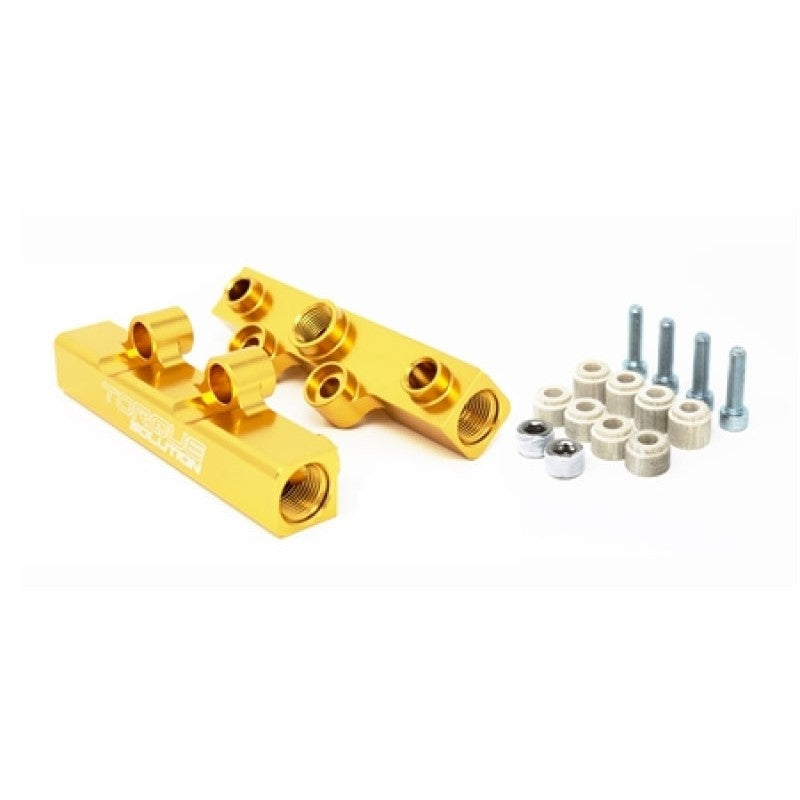 Gold anodized Torque Solution CNC-machined top feed fuel rails for Subaru WRX and STI engines.