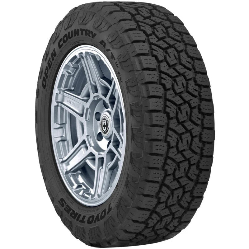 Toyo Open Country A/T III all-terrain tire showing aggressive tread block design and sidewall markings