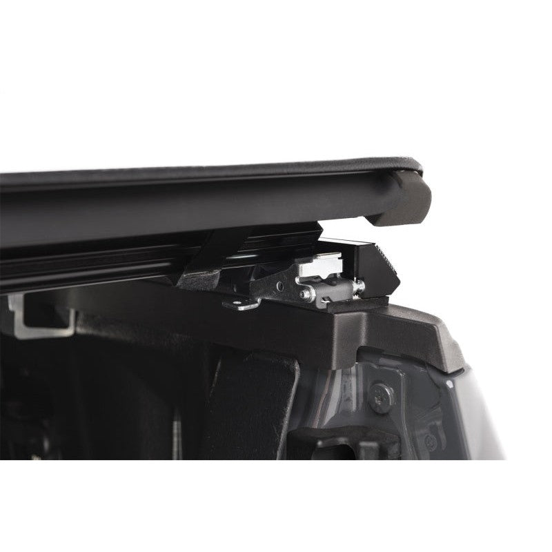 TruXedo TruXport black soft roll-up tonneau cover on a 2009-2014 Ford F-150 with a 5.5-foot bed