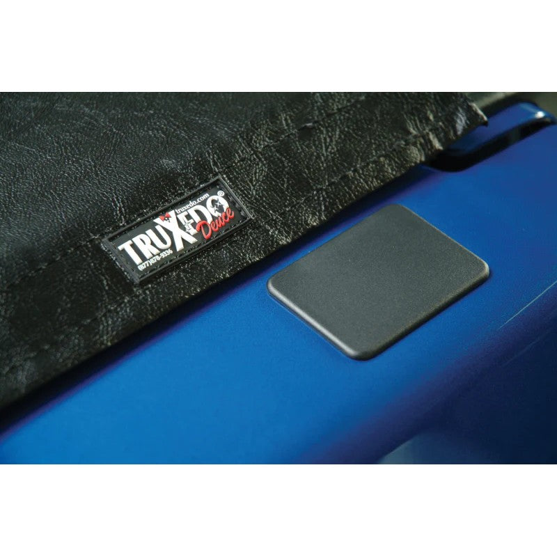 Set of four black high-impact plastic TruXedo stake pocket covers for 2009-2024 Dodge Ram bed rails.