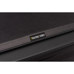TruXedo TruXport black leather-grain roll-up tonneau cover with 1.5-inch profile on a Chevy Silverado truck bed.