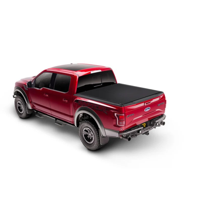 Truxedo Sentry CT matte black hard roll-up truck bed cover with interlocking aluminum slats and woven fabric surface.