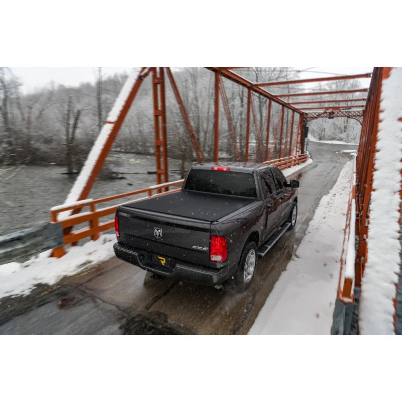 TruXedo Sentry CT hard roll-up tonneau cover in matte black woven fabric on a 2019-2026 Ram 1500 truck bed.