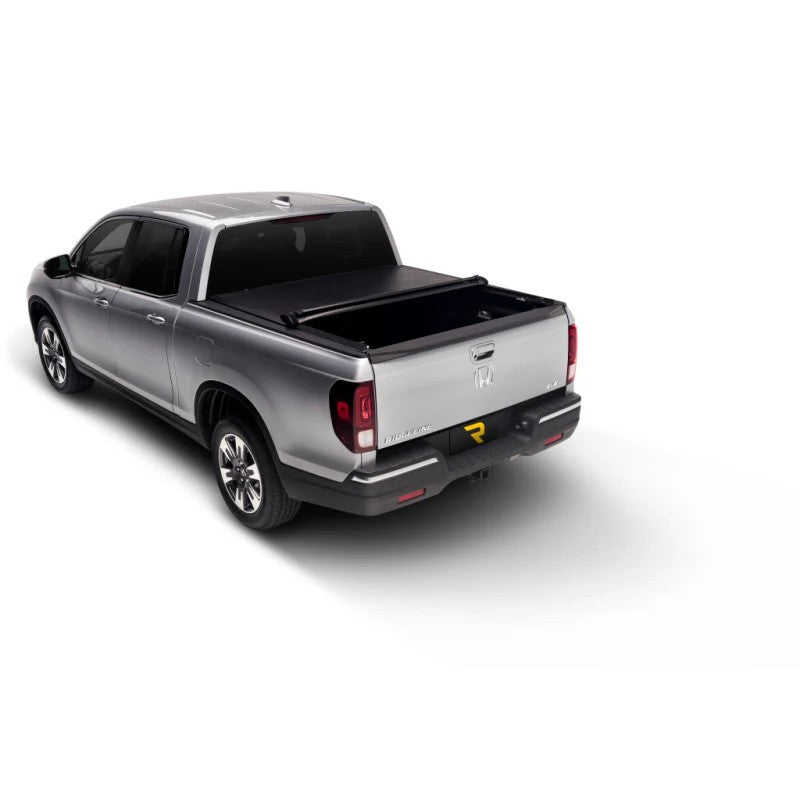 Black TruXedo Lo Pro roll-up tonneau cover installed on a 1997-2004 Ford F-150 Flareside with a 6.5-foot bed.