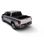 Black TruXedo Lo Pro roll-up tonneau cover installed on a 1997-2004 Ford F-150 Flareside with a 6.5-foot bed.