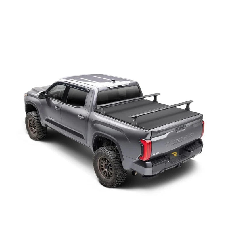 Black powder-coated aluminum Truxedo Elevate FS Base Rack uprights and mounting hardware for T-slot truck bed rails.