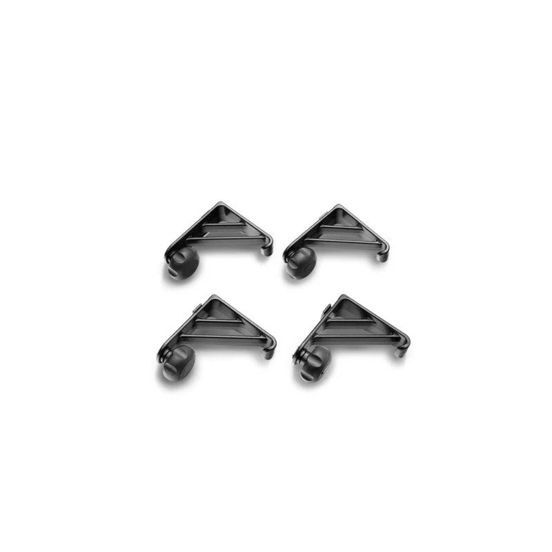 Four black powder-coated aluminum Truxedo Elevate load stops with integrated tie-down anchors and adjustment thumbscrews.