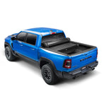 TruXedo TonneauMate black under-the-rail storage toolbox mounted in a full-size truck bed