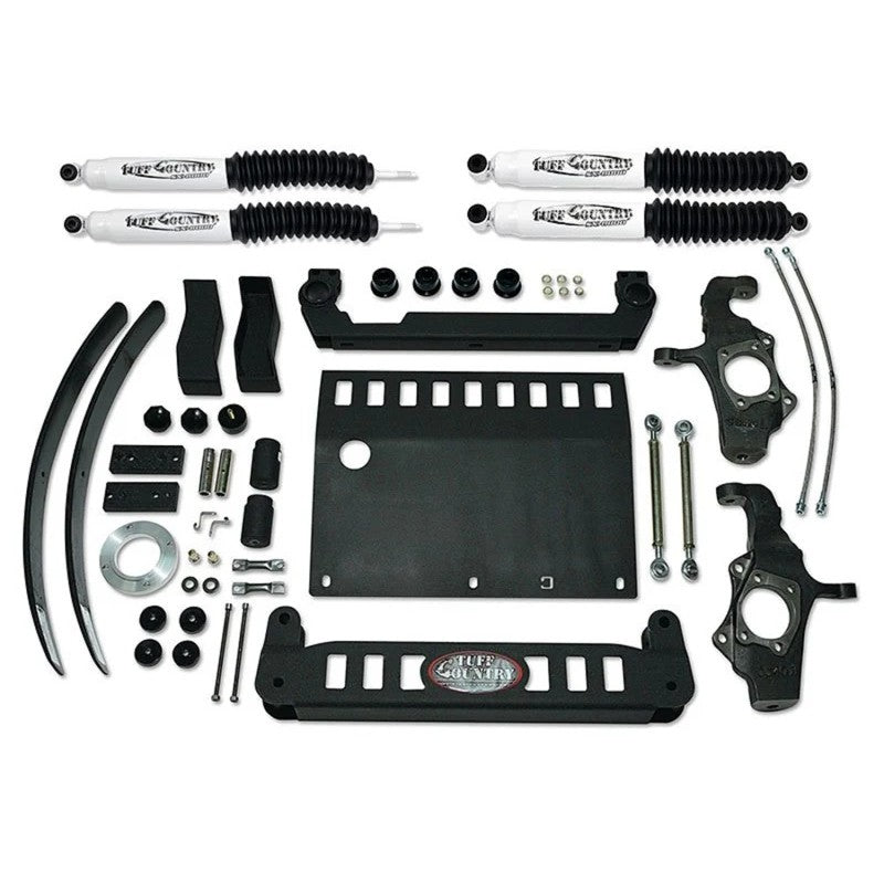 Tuff Country 4-inch suspension lift kit featuring steering knuckles, cross members, hardware, and SX8000 gas shocks.