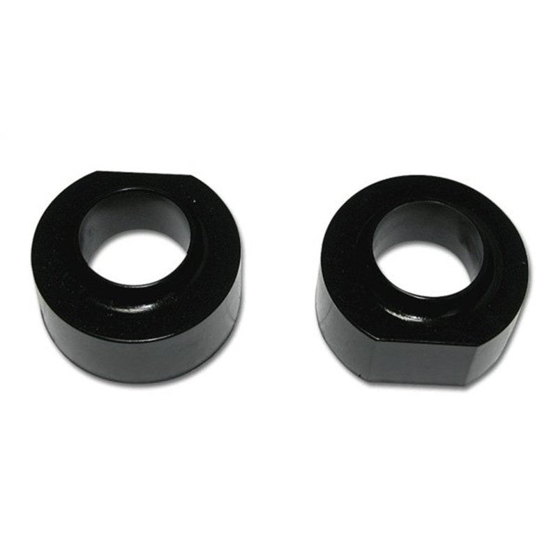 Pair of black 1.5 inch high-density polyurethane coil spring spacers for Jeep suspension systems.