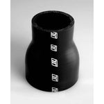 Black Turbosmart reinforced silicone hose reducer transitioning from 2.25-inch to 2.75-inch diameter.