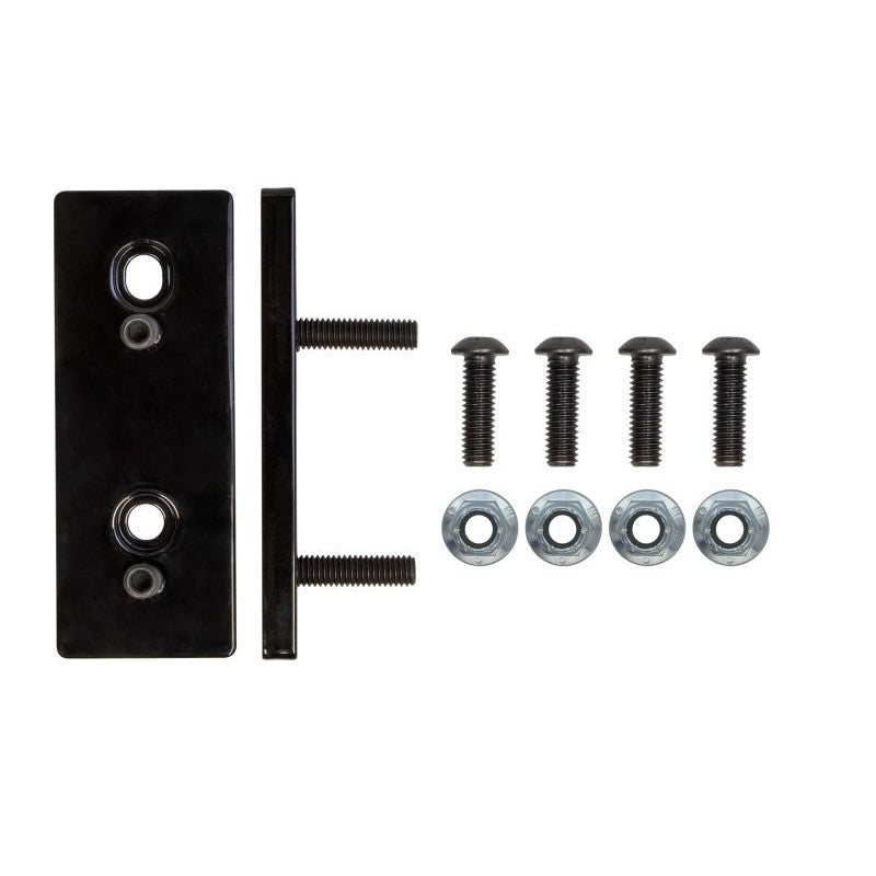 Black anodized 0.375 inch thick laser-cut steel front sway bar relocation spacers with elongated mounting holes.