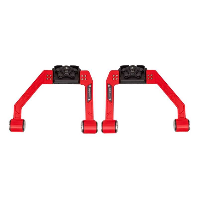 Red UMI Performance adjustable upper A-arm kit for 2015-2026 Ford F-150 featuring CNC-machined steel and Delrin bushings.
